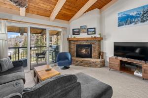 a living room with a couch and a fireplace at Crestwood 3312 Standard 1 Bedroom Plus Loft in Snowmass Village