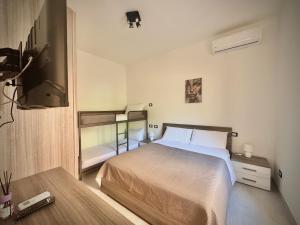 En eller flere senge i et værelse på Santa Marinella Homes Casa 5