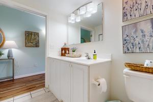 a bathroom with a sink and a mirror at Water Street Condos Unit 310 in Wilmington +24 photos