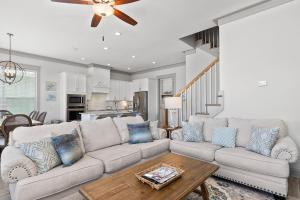 a living room with a couch and a table at Endless Summer in Gulf Shores +38 photos