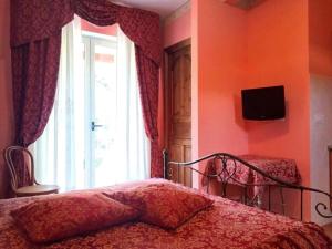 a bedroom with a bed and a window at Green Sunset in Tramonti