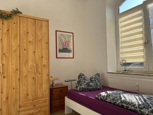 เตียงในห้องที่ Havenwelten Apartment