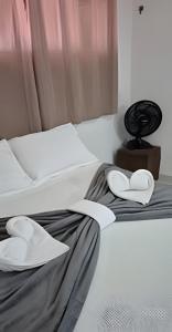 Ένα ή περισσότερα κρεβάτια σε δωμάτιο στο Flat beira-mar Natal