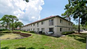 a large white building with a yard in front of it at Very Close To IMG Academy, Beaches, Restaurants in Bradenton