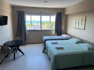 Postel nebo postele na pokoji v ubytování Porto da Praia Flat Cumbuco