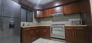 Η κουζίνα ή μικρή κουζίνα στο Departamento completo en Las Quintas Culiacan