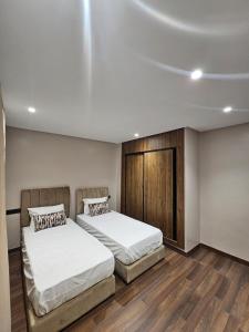 Postel nebo postele na pokoji v ubytování Luxury Apartment 5min CFC