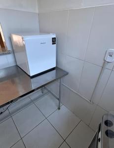 Kuchyň nebo kuchyňský kout v ubytování Flat confortável + 2 fotografie