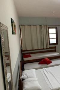 Katil atau katil-katil dalam bilik di Pousada Paraiso - Predio N 124