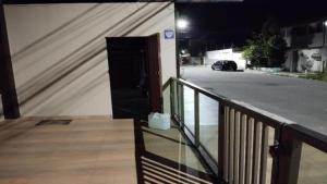 a door on the side of a building at night at Pousada Paraiso - Predio N 124 in Guarapari