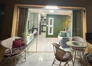 a living room with a couch and a table and chairs at Flat Winterville Residence Gravatá in Gravatá