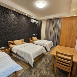 Ένα ή περισσότερα κρεβάτια σε δωμάτιο στο Modern Hotel-Style Apartment