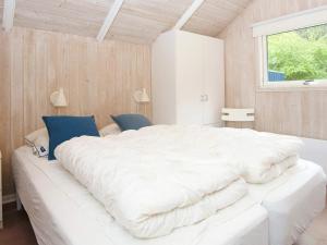 Ένα ή περισσότερα κρεβάτια σε δωμάτιο στο 6 person holiday home in Fårvang-By Traum