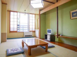 TV a/nebo společenská místnost v ubytování ホテルヴィレッジ圓山