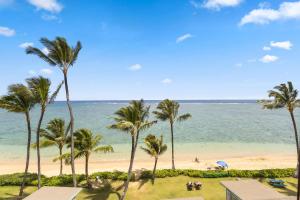 a view of a beach with palm trees and the ocean at Beachfront Studio w Amazing Views in Hauula