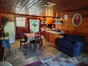 a living room with a table and a couch at O'Brien's Oasis in Miramonte