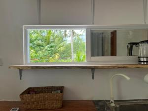 a window in a kitchen with a counter and a sink at Padayon Island Stay in General Luna
