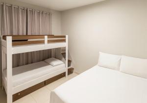 a bedroom with a bunk bed and a white bed at Apartamentos Porto Maravilha in Rio de Janeiro +56 photos