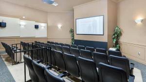 a lecture room with black chairs and a screen at Orlando Disney Holiday Palace in Orlando +33 photos
