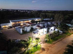 an aerial view of a large white building at night at Novo Hotel Paranatinga in Pôsto Indígena Batovi