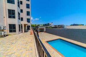 a swimming pool on the roof of a building at Platinum22 - Across From AC Marriott Hotel in Kingston
