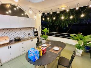 a kitchen with a table with drinks on it at Gem's House 1- Balcony with Riverside View in Ho Chi Minh City +15 photos