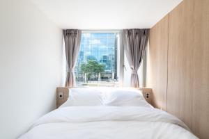 Postel nebo postele na pokoji v ubytování Hi Stay Myeongdong