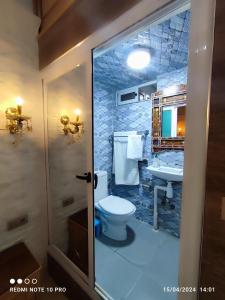 a bathroom with a toilet and a sink at Dar NABIL in Chefchaouen +72 photos