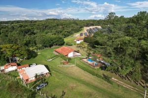 an aerial view of a house on a hill at Pousada Vossa Excelência in Cajuru +115 photos