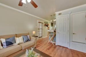 a living room with a couch and a kitchen at The Homestead Apartments- Walk to SFA Campus, Comfy, Children & Pet-Friendly Nacogdoches Condo in Nacogdoches