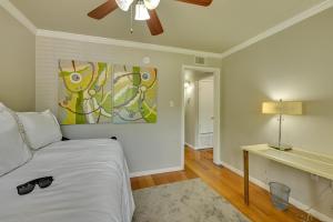 a bedroom with a bed and a painting on the wall at The Homestead Apartments- Walk to SFA Campus, Comfy, Children & Pet-Friendly Nacogdoches Condo in Nacogdoches