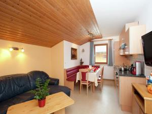 a living room with a couch and a table at Apartment near the ski area in the Salzburg region in Altenmarkt im Pongau