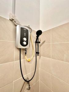 a shower in the corner of a bathroom at SsrHome325 Light Luxury Floating Bed B&B Seremban4r3b B&B 轻奢风格 in Seremban +62 photos