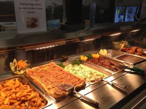 a buffet line with many different types of food at Karratha Lodge TWA in Karratha