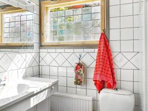 a bathroom with a toilet and a window at 4 person holiday home in Hemse in Hemse +28 photos
