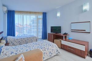 Postel nebo postele na pokoji v ubytování Family Hotel Regata