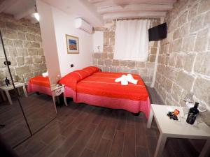 Posteľ alebo postele v izbe v ubytovaní Plaza Stone Apartment