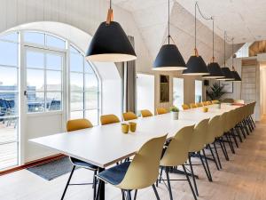 a large conference room with a long table and chairs at 5 star holiday home in Ringkøbing in Ringkøbing