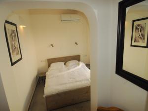 a small bedroom with a bed in a room at Elegant Escape in Benissa in Benissa