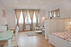 Posteľ alebo postele v izbe v ubytovaní Aurora Apartment Danube View
