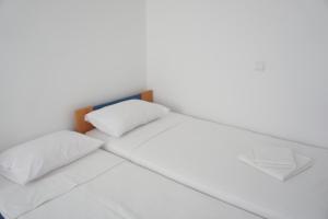 Postel nebo postele na pokoji v ubytování Rodos Beach