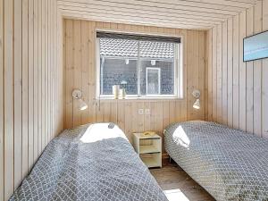 a bedroom with two beds and a window at 5 star holiday home in Kappeln in Kappeln