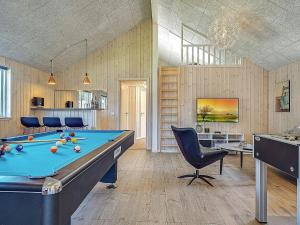 a billiard room with a pool table and chairs at 5 star holiday home in Kappeln in Kappeln