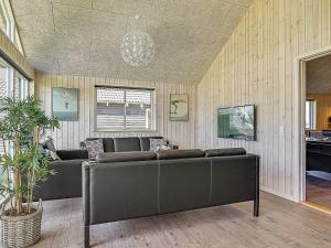 a living room with couches and a chandelier at 5 star holiday home in Kappeln in Kappeln