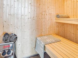 a sauna with a bench and a stove in it at 5 star holiday home in Kappeln in Kappeln +11 photos