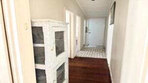 a hallway with a stone fireplace in a house at Twin Dolphins 1, 1 - 18 Clarence St in Yamba