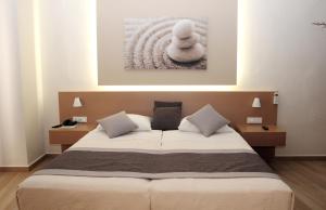 Postel nebo postele na pokoji v ubytování Renieris Hotel