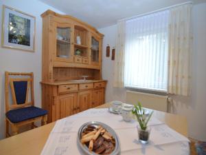 a kitchen with a table with a bowl of food on it at Holiday home in Ramsbeck with garden in Ramsbeck +32 photos