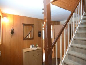 a room with a staircase and a stair case at Holiday home in Ramsbeck with garden in Ramsbeck