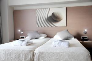 Postel nebo postele na pokoji v ubytování Renieris Hotel